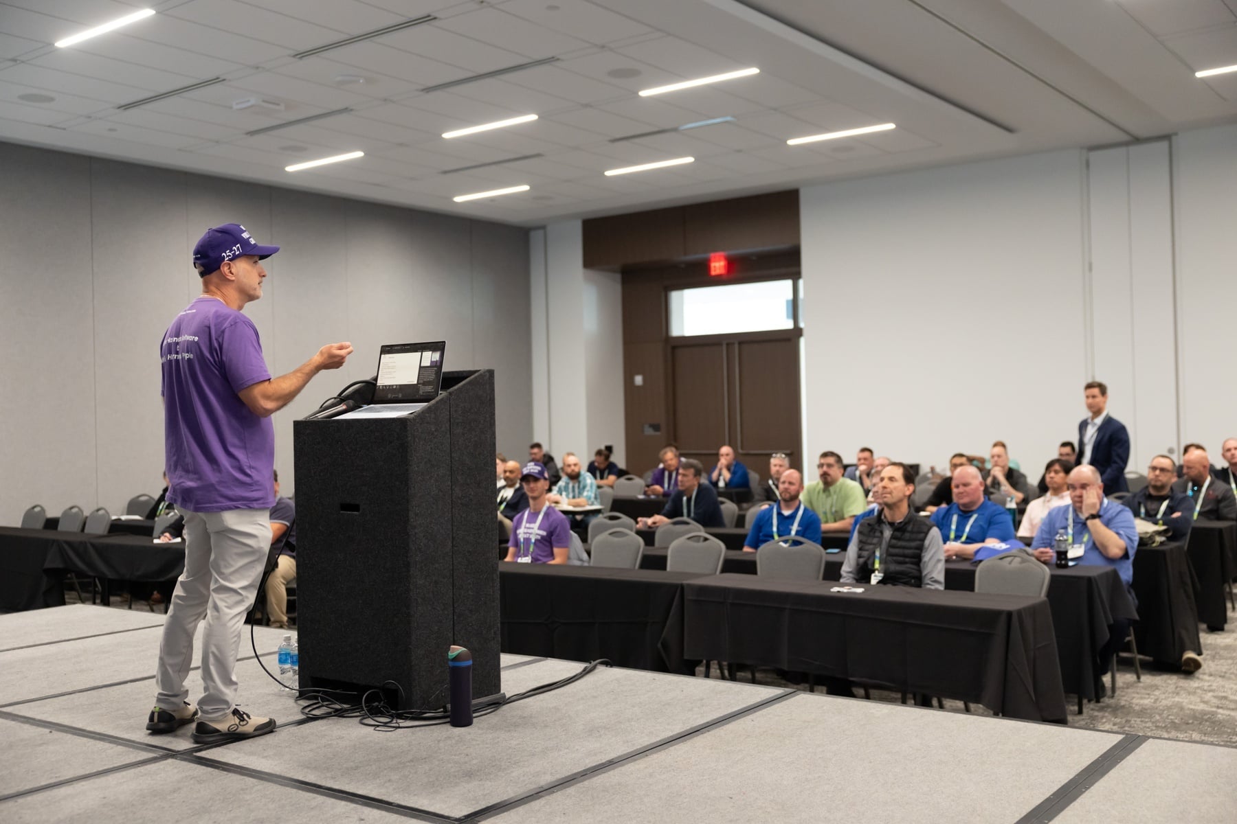 Arik Vrobel, founder of Cableteque, presenting to wire harness manufacturers at EWPTE 2025